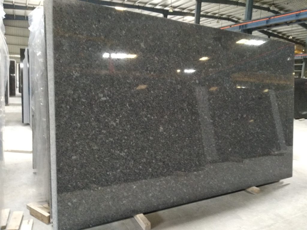 Steel grey granite gangsaw slabs in a polished finish