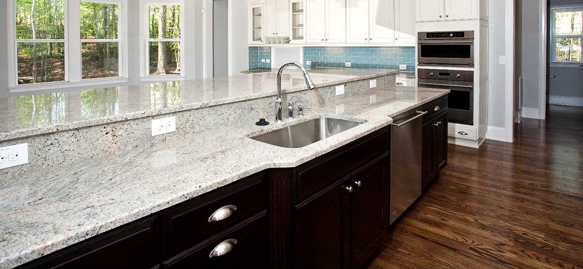 Kashmir White Granite Dark Cabinets