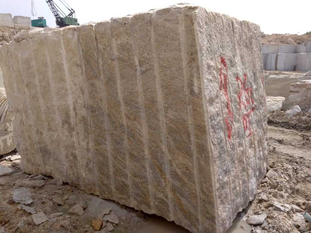 ivory white granite block in quarry