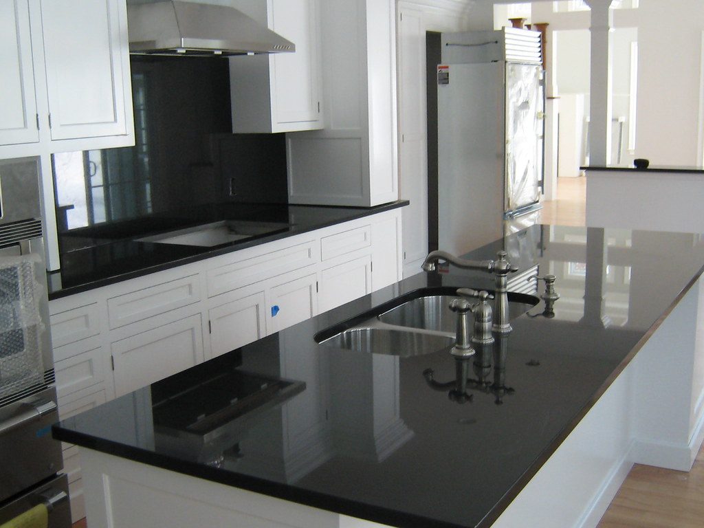 Absolute Black granite countertop with white cabinets